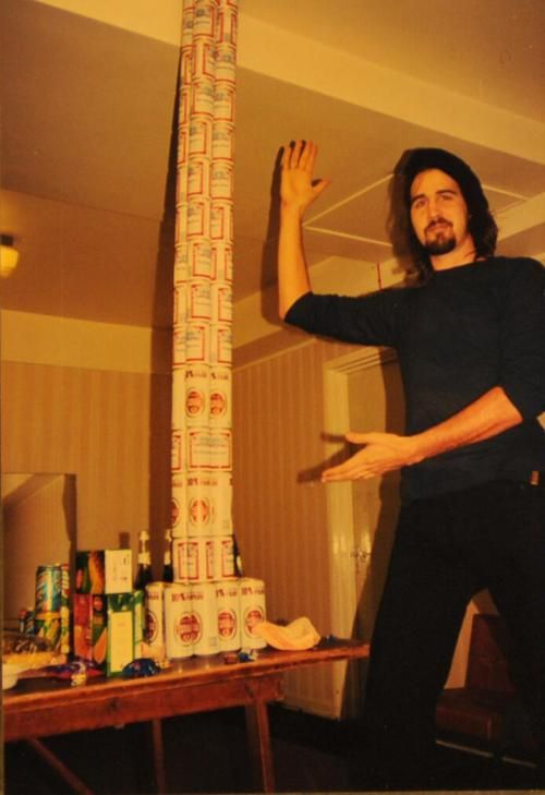 Krist Novoselic With A Long Stack Of Beer Cans