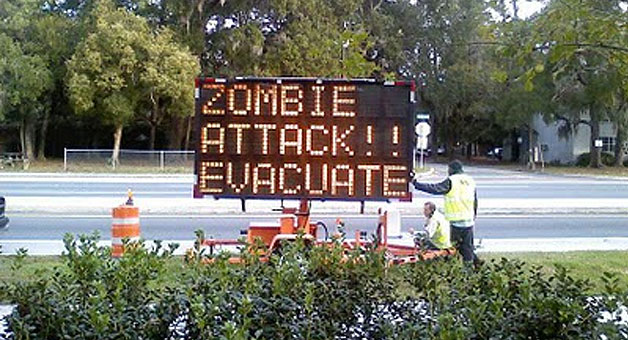 Road Sign: 'Zombie Attack - Evacuate!'