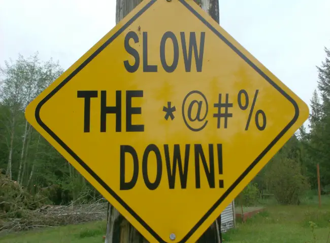 Funny Road Sign - Slow the **** Down!