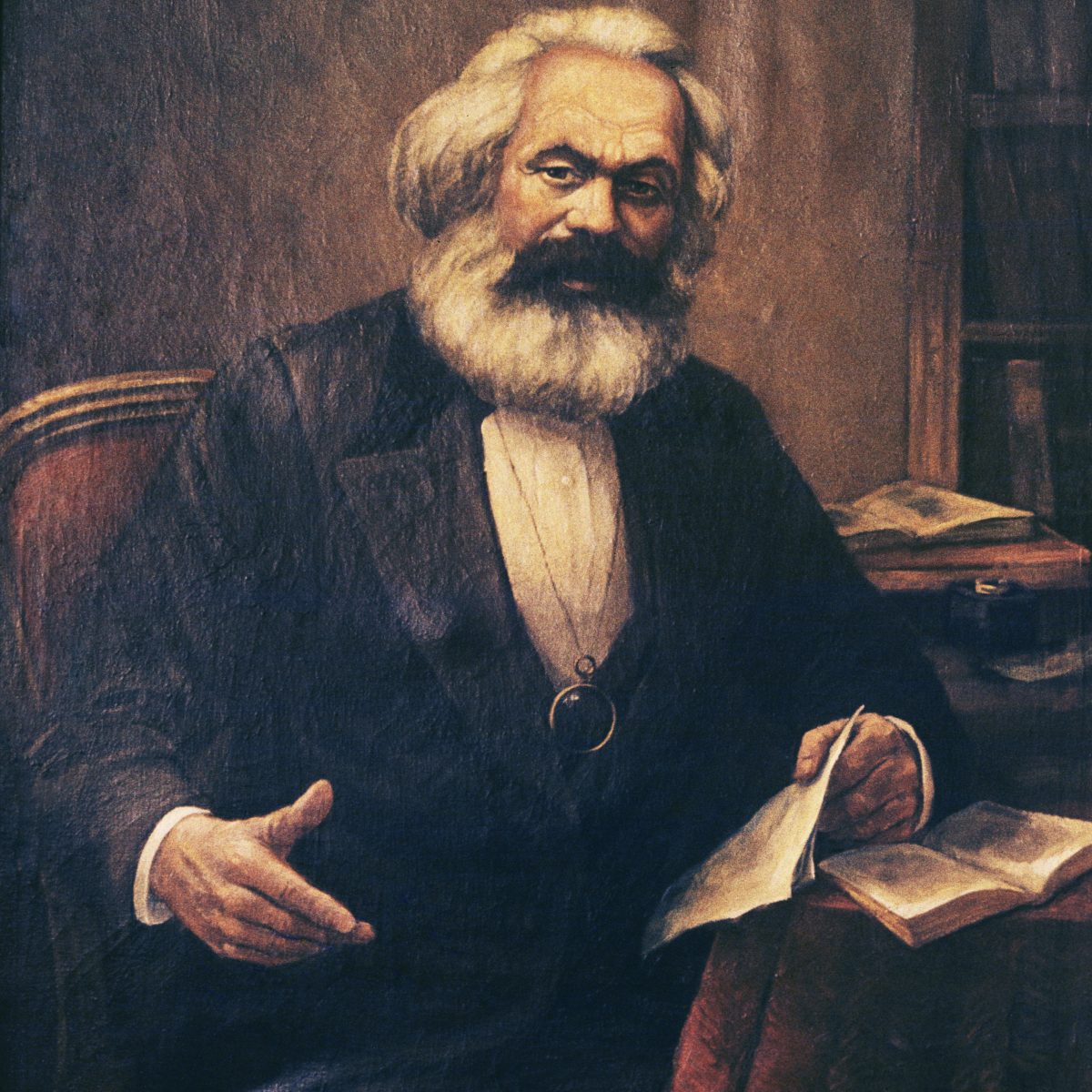 Karl Marx Sitting In A Chair