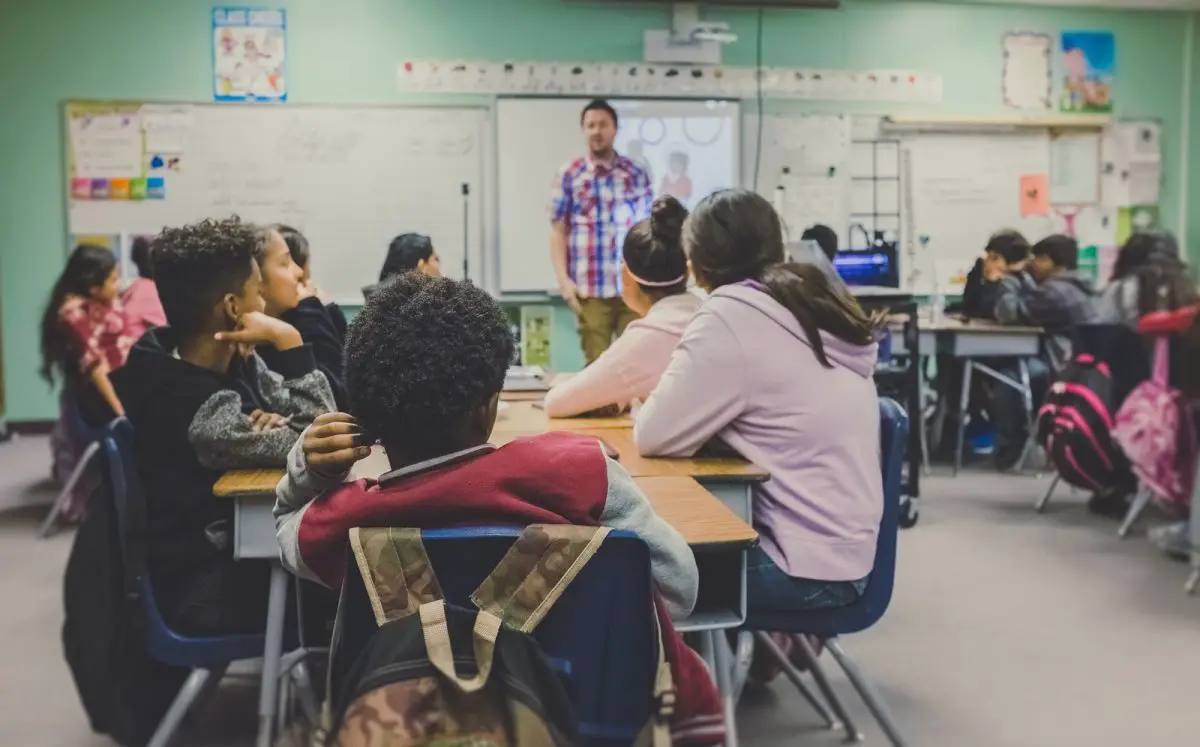 Teacher And Students In A High School