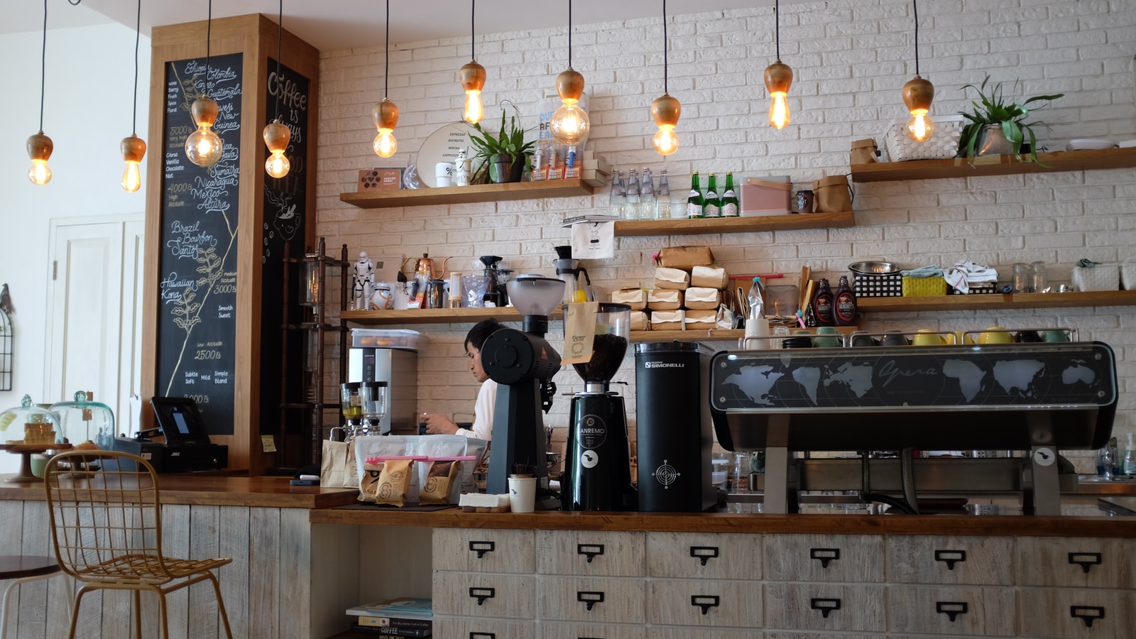 Barista Behind Coffee Shop Counter