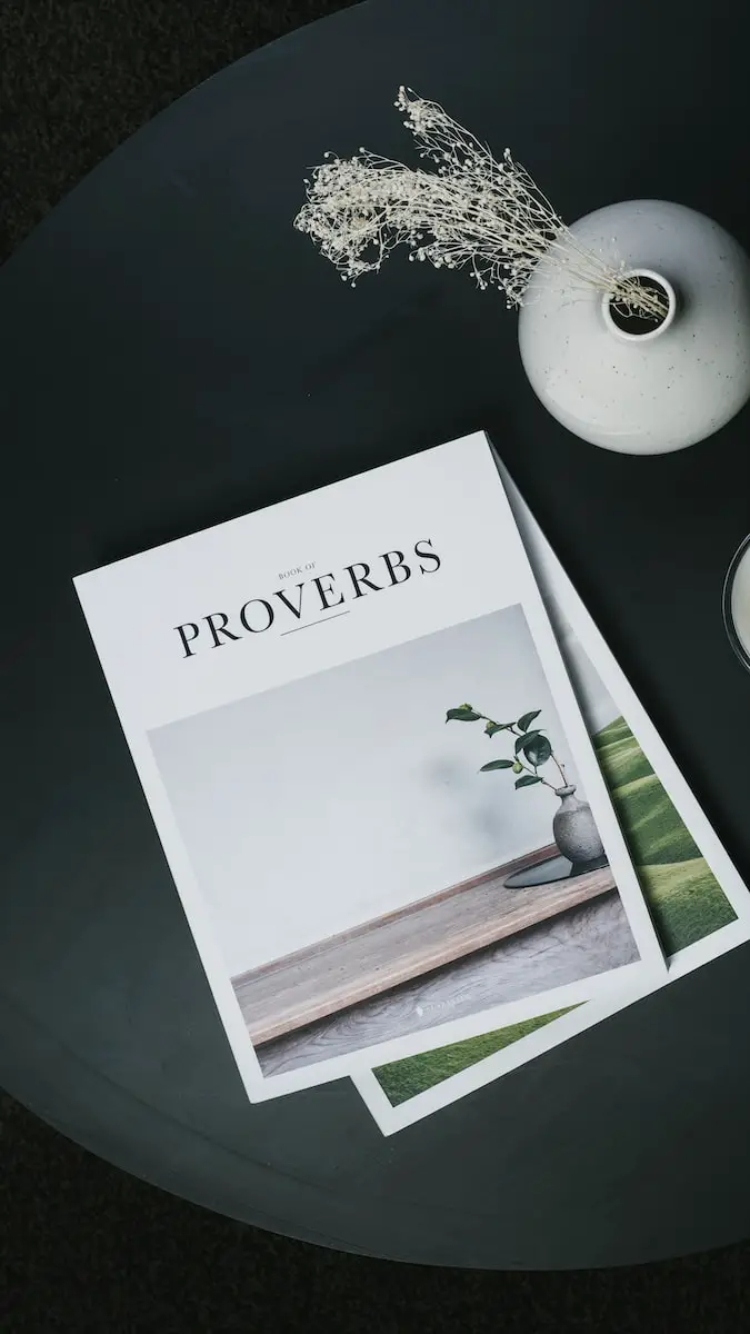 Book of Proverbs on black table