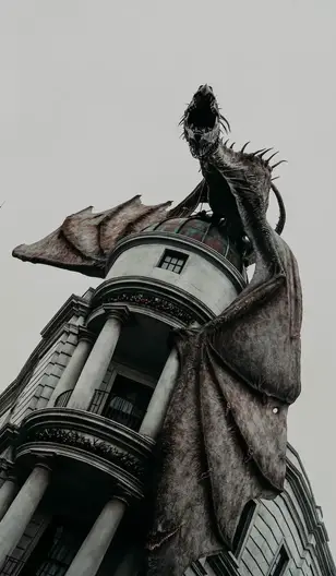statue of dragon on gray building